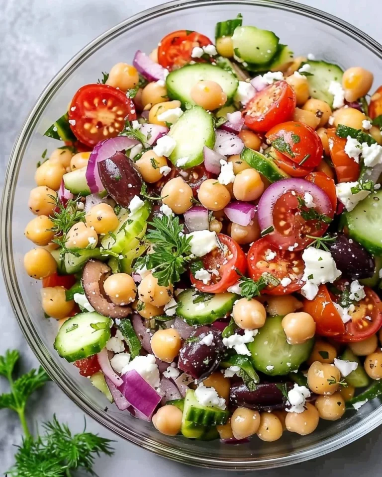 Bowl of Greek chickpea salad with vegetables and feta cheese